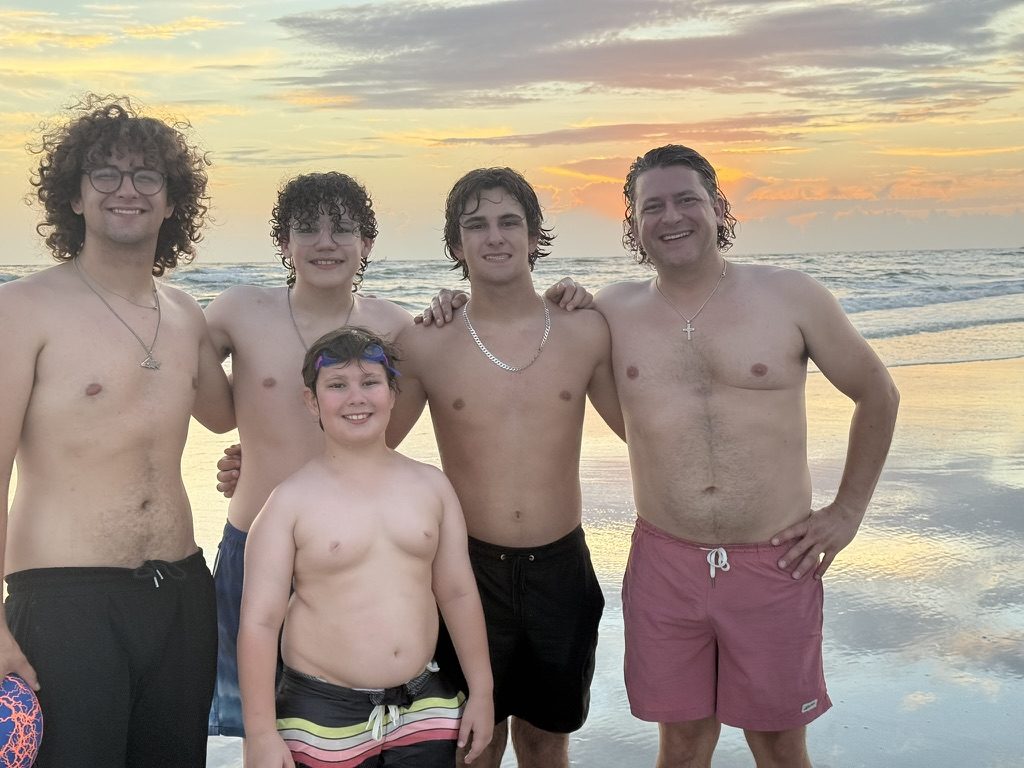 The four boys with Dad at the beach